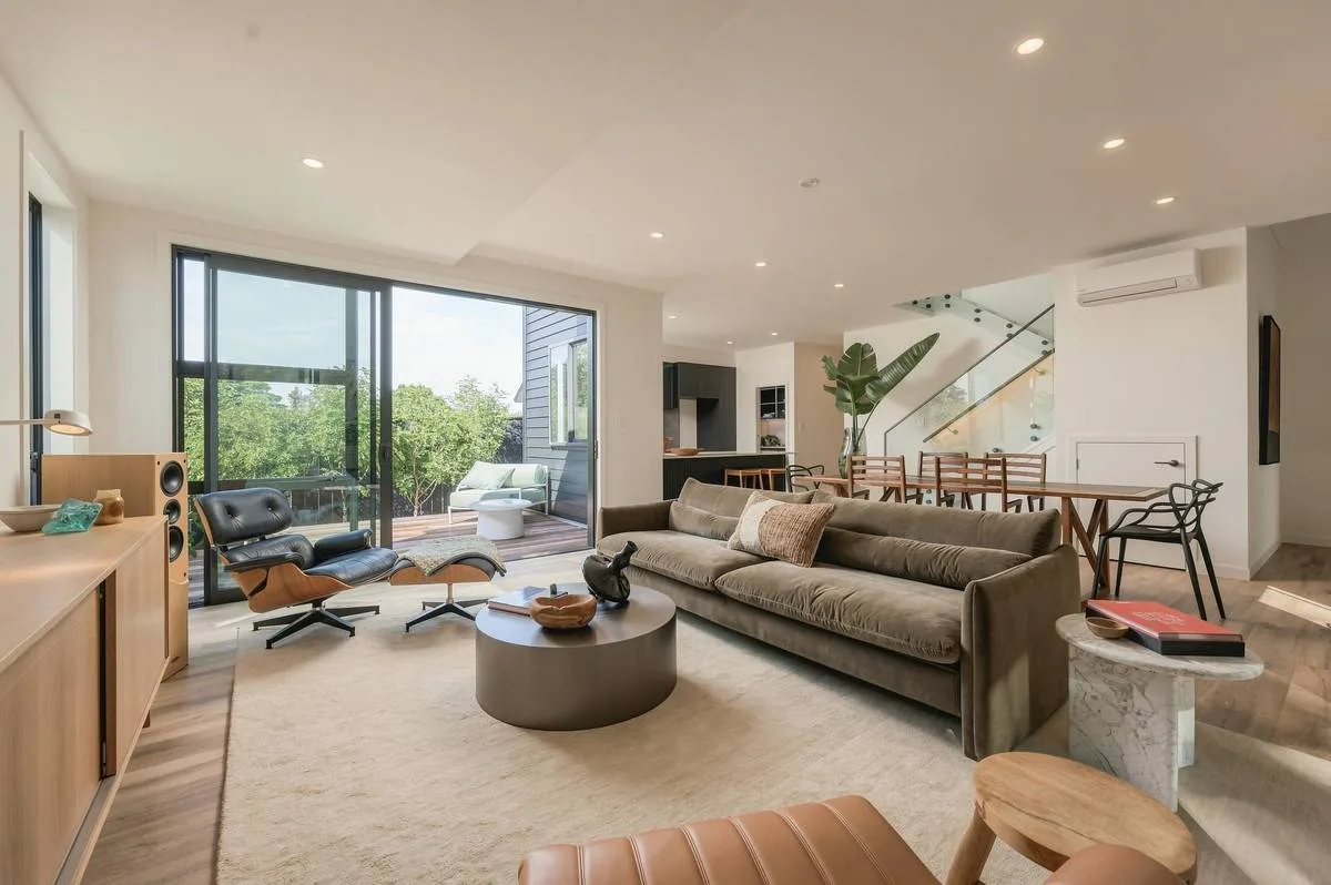 Living room with floor-to-ceiling glazing, Auckland home, editorial finish