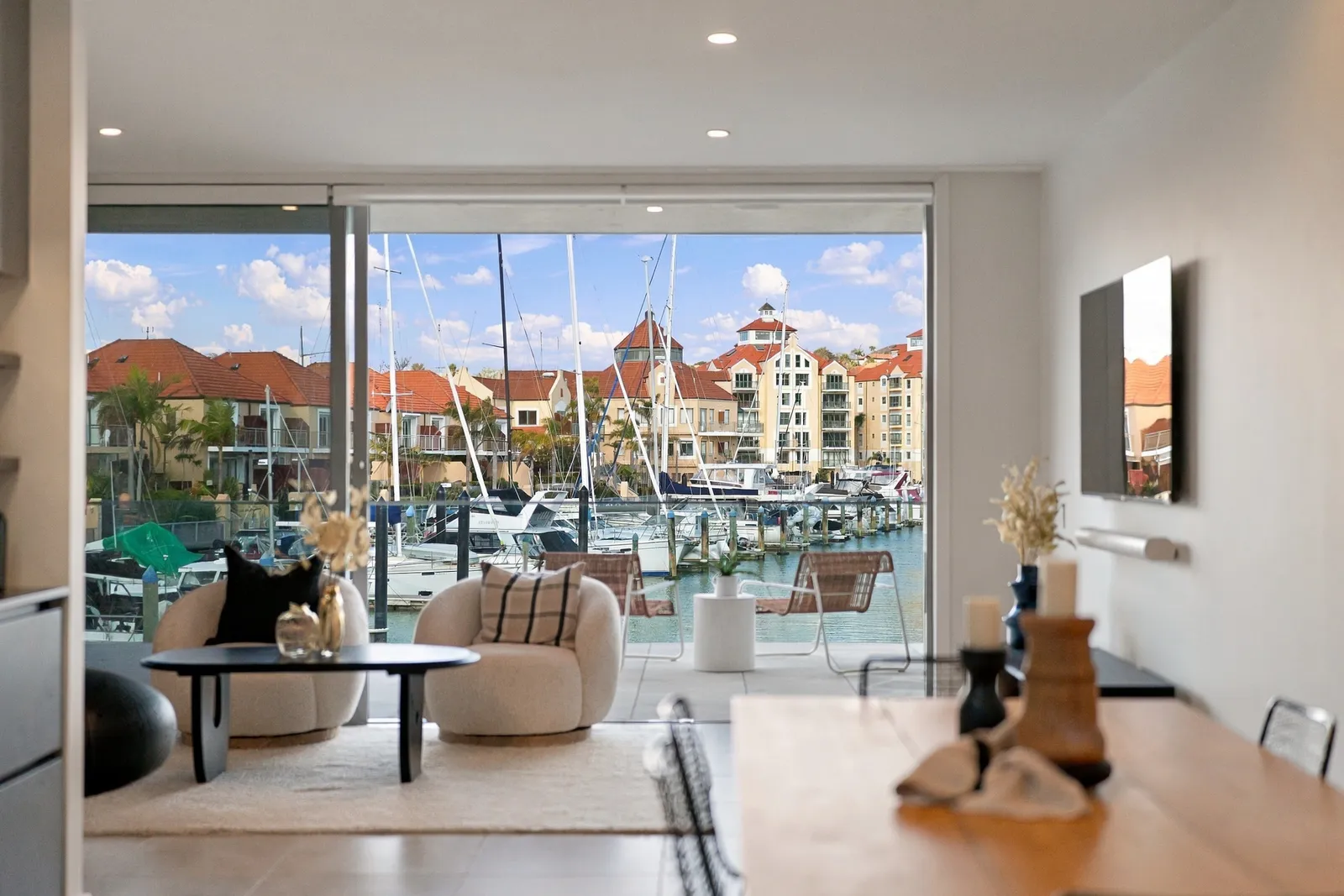 Dining, out to the water, waterfront townhouse in Gulf Harbour, Hibiscus Coast