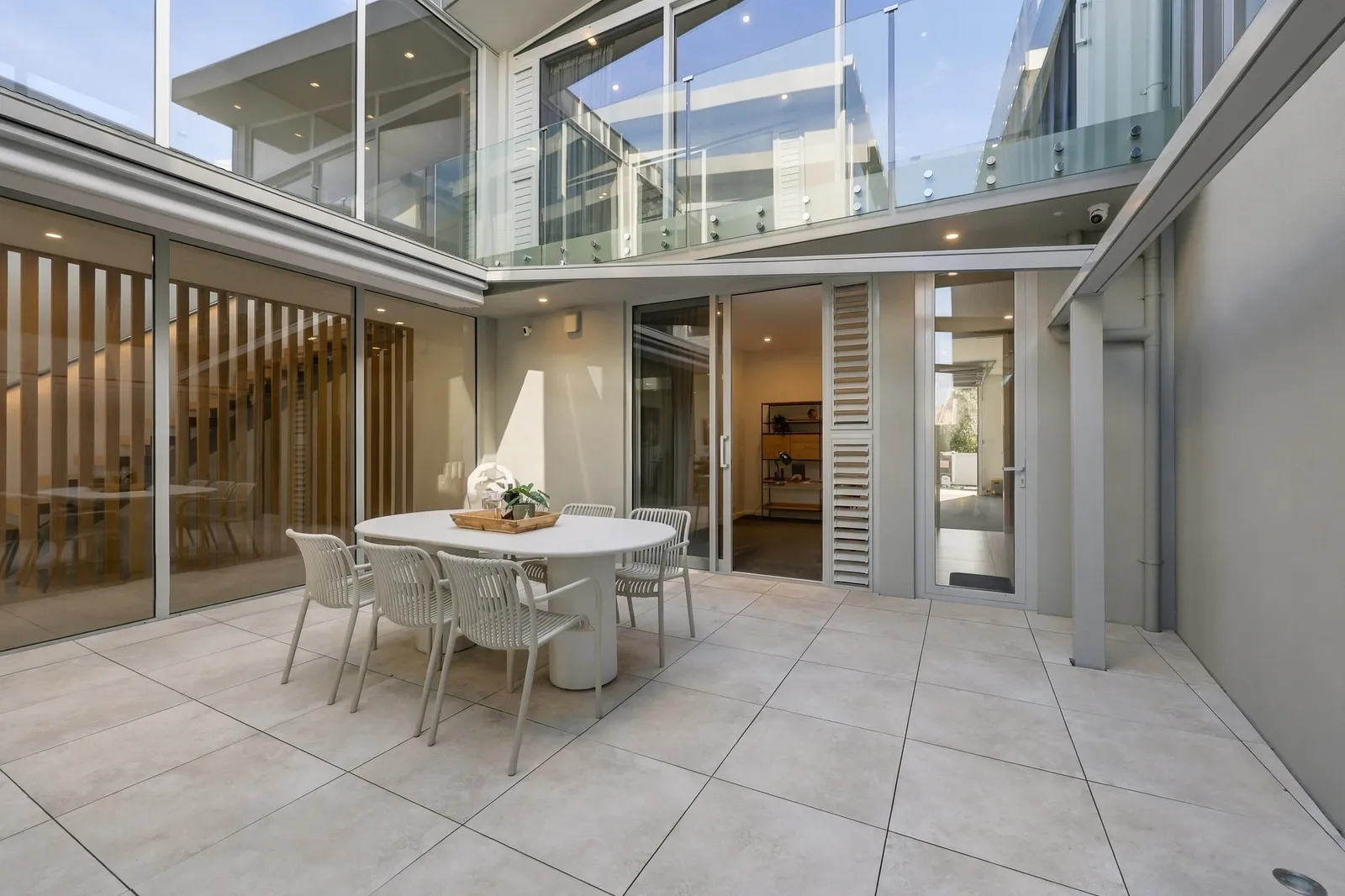 Courtyard dining, waterfront townhouse in Gulf Harbour, Hibiscus Coast