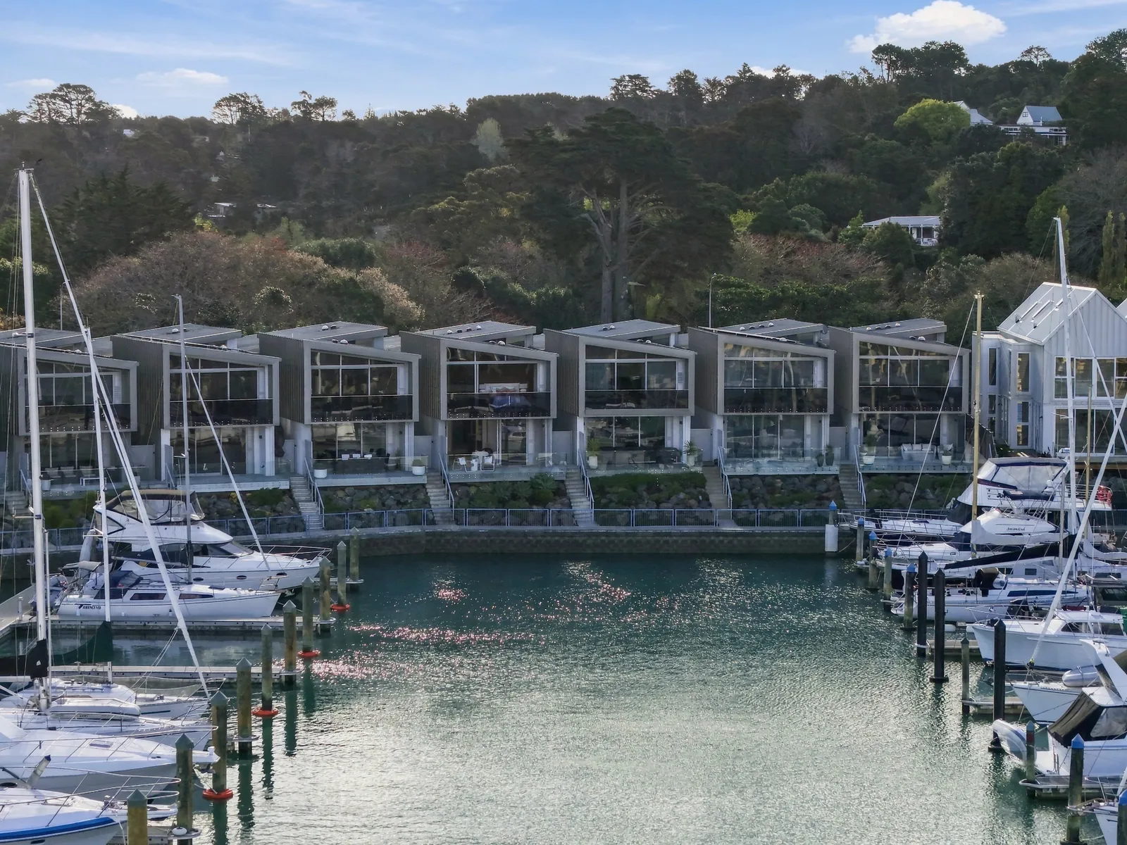Aerial, from the water, waterfront townhouse in Gulf Harbour, Hibiscus Coast