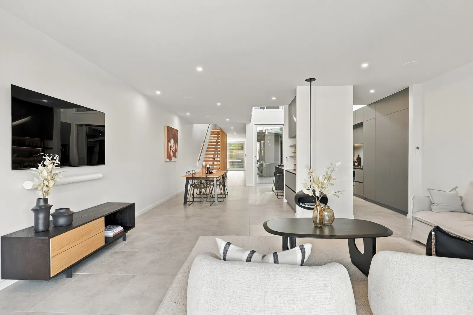 Living through to the kitchen, waterfront townhouse in Gulf Harbour, Hibiscus Coast