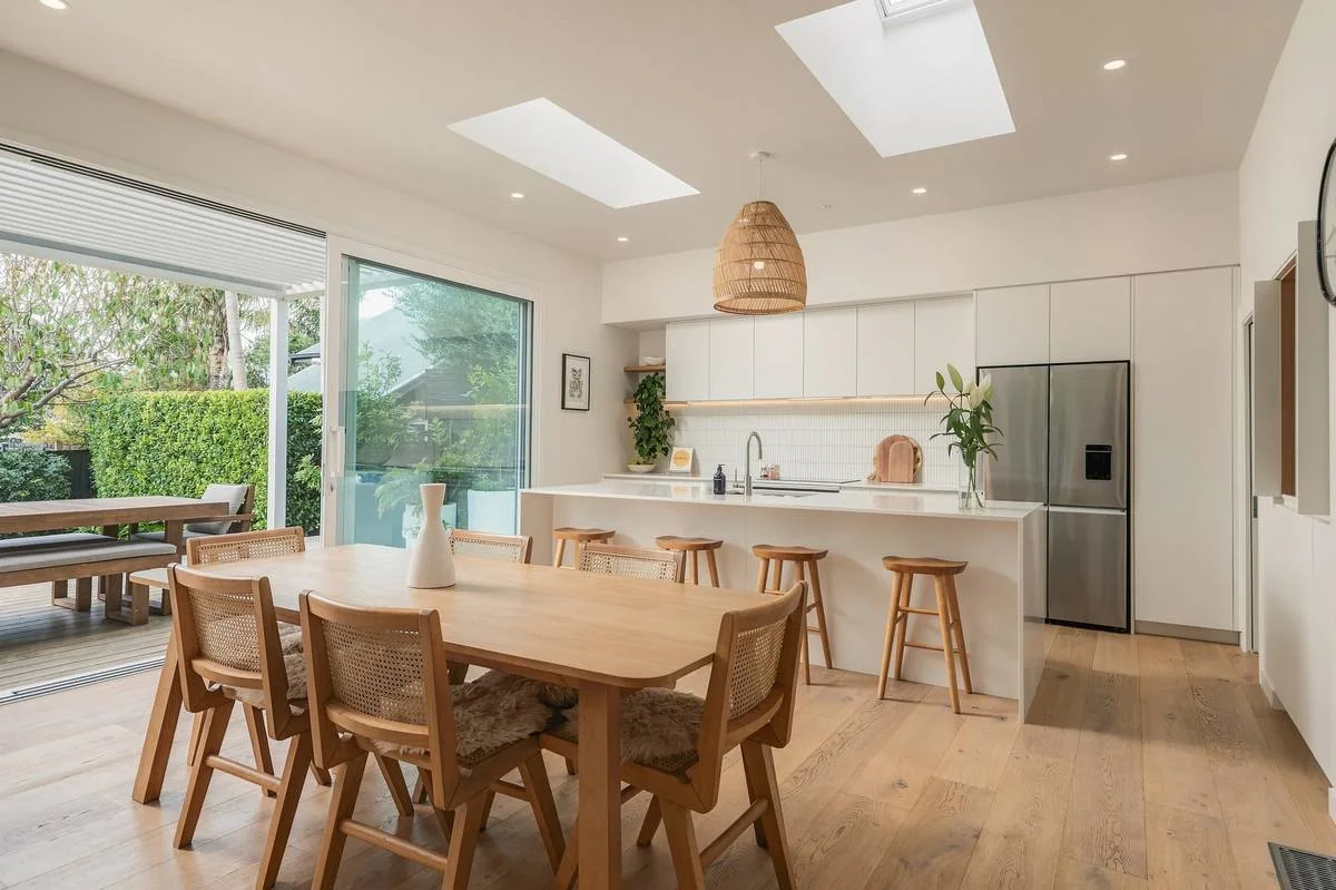 Living room with doors open to the garden, editorial finish